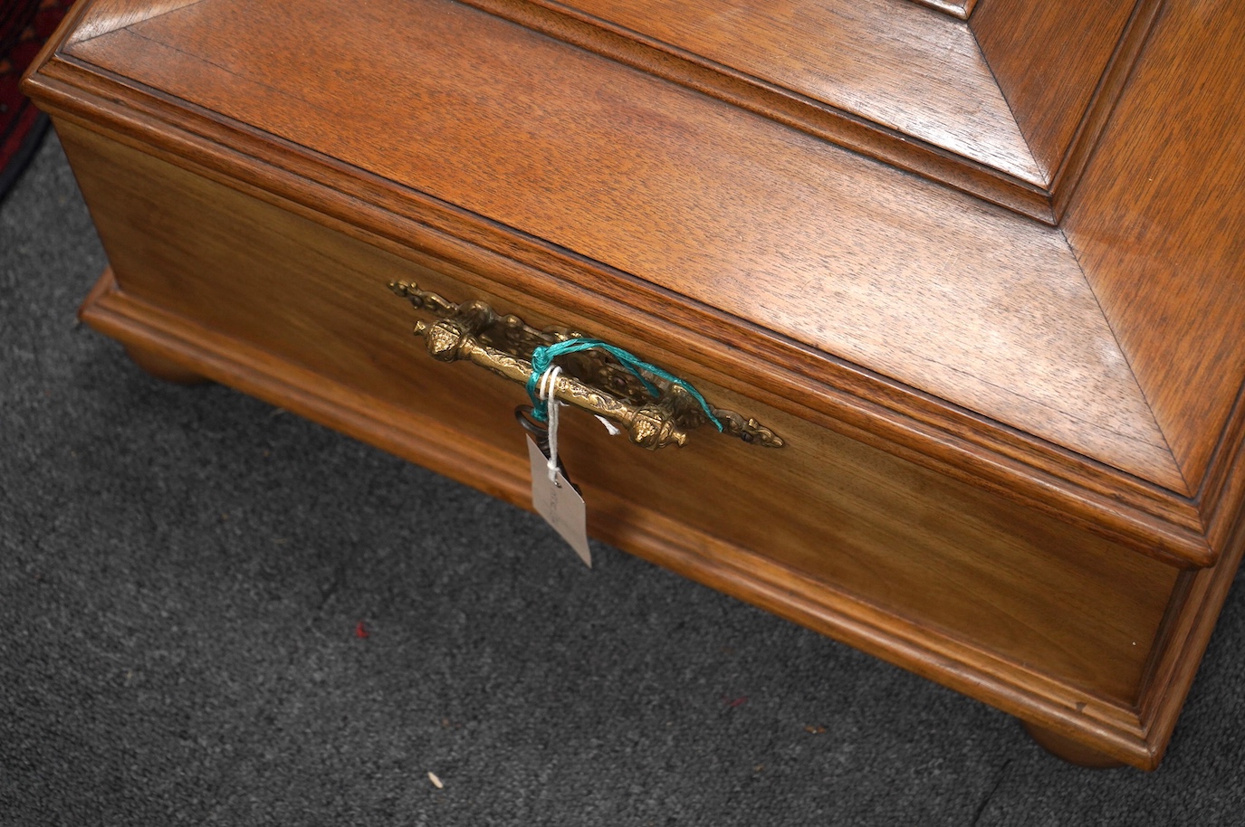 A walnut cased Orphenion, the replacement case is understood to have been constructed from panels from RMS Mauretania, 64cm wide, 49cm deep, 23cm high, with twenty-two 41cm diameter discs. Condition - good.